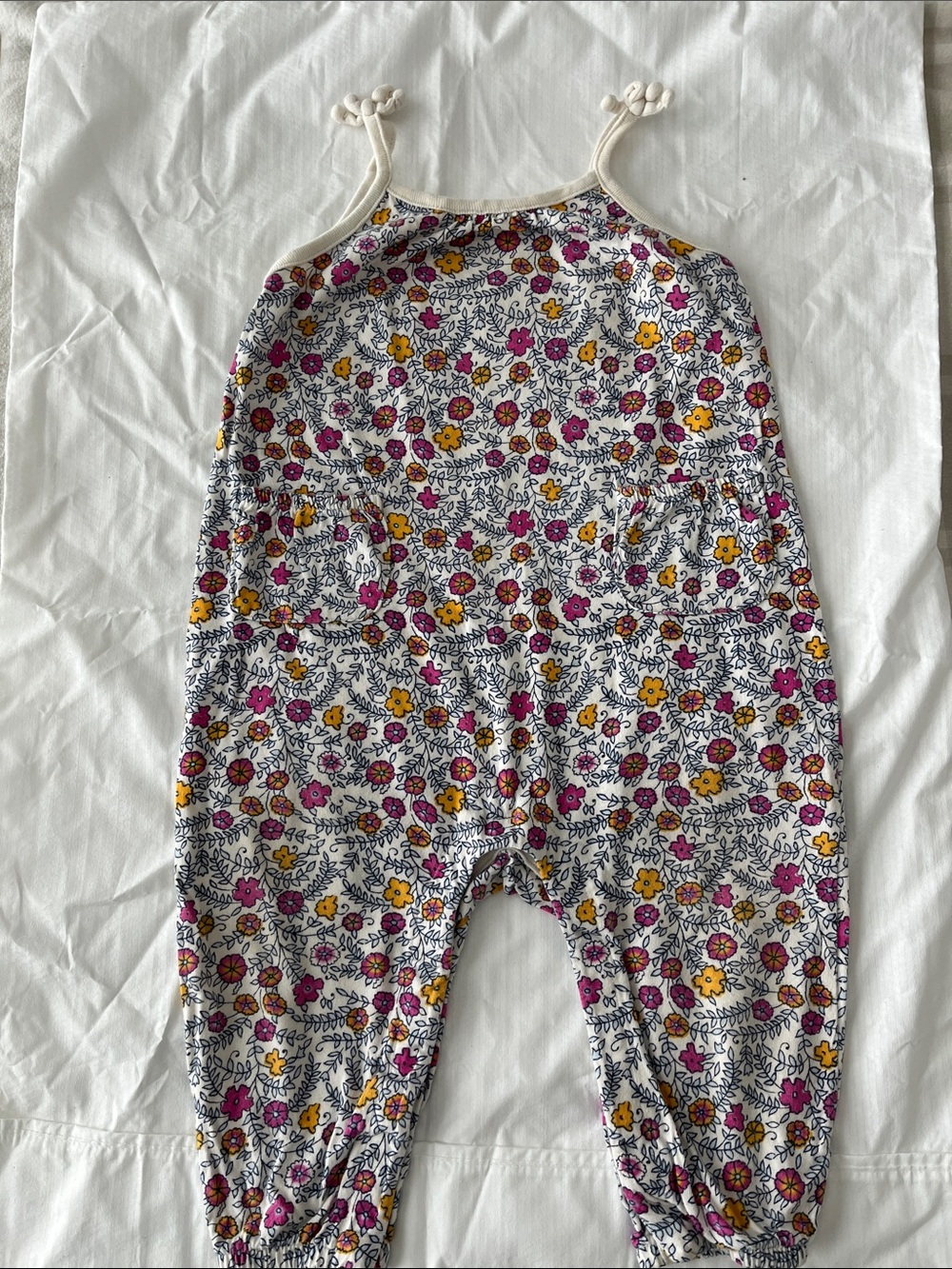 Girls Floral Knit One-Piece Romper with pockets and easy snaps for changing